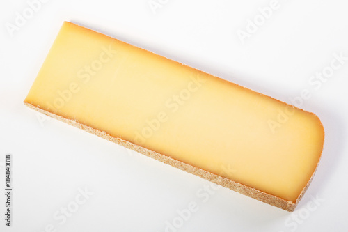 One big part of french cheese comté on white background. Flat lay meal