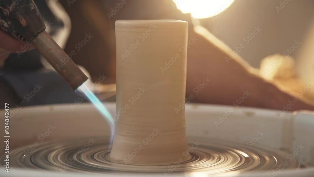 Pottery firing clay shape blowtorch, closeup. Stages of work in a