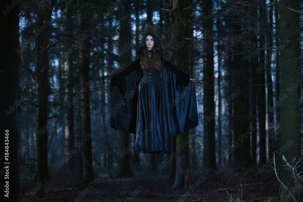 Witch levitating in the forest Witch levitating in the forest