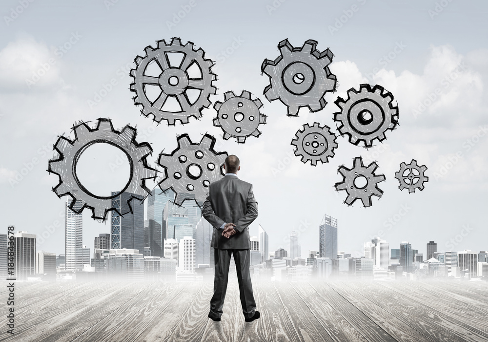 Cogwheel engine drawn on screen as symbol for teamwork and coope