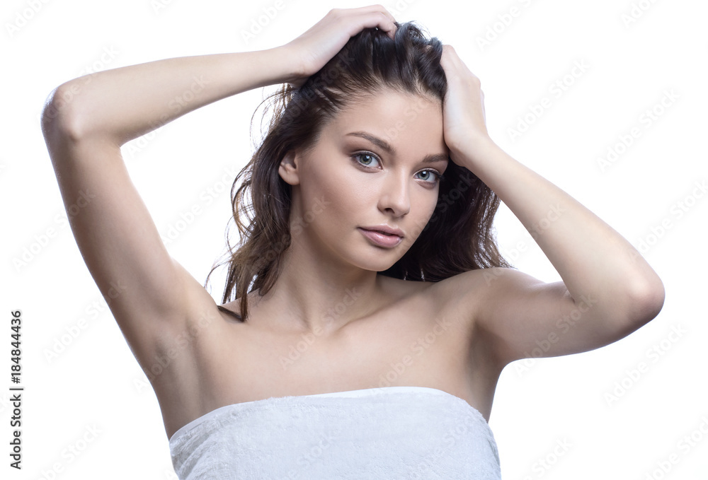 Beautiful brunette girl with healthy hair. SPA concept. Isolated on white Beautiful brunette girl with healthy hair. SPA concept. Isolated on white