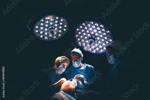 Doctors operating kneecap. photo