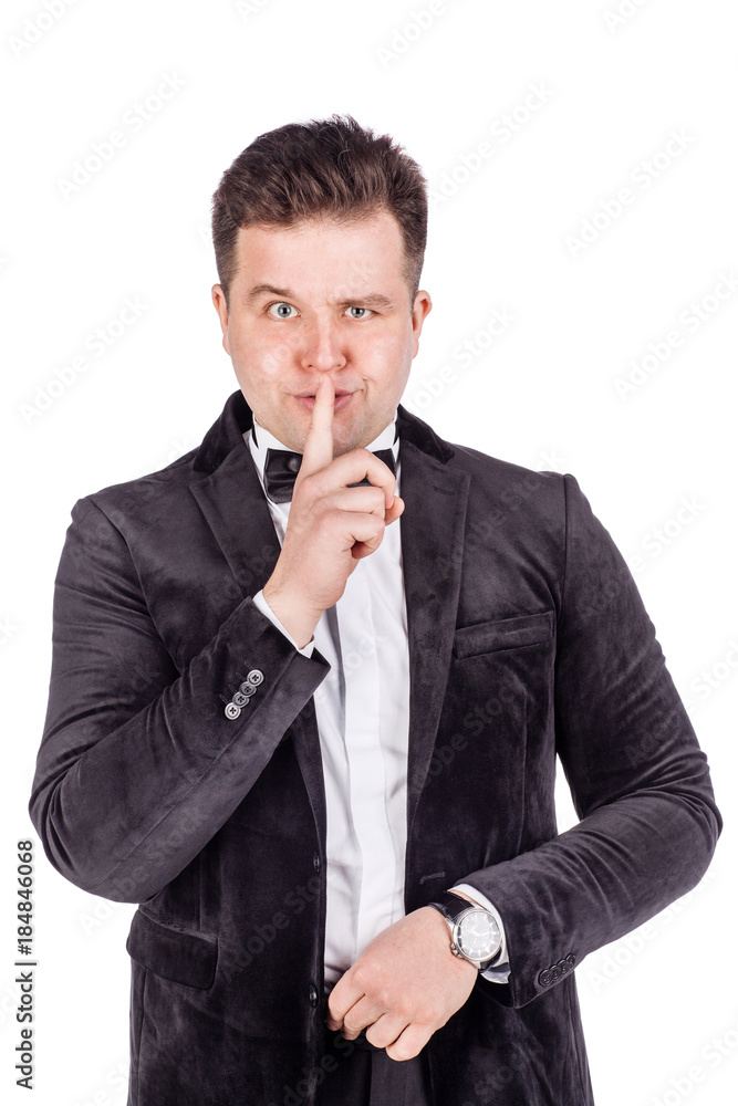 man making a shushing gesture raising his finger to his lips. emotions, facial expressions, feelings, body language, signs.. man making a shushing gesture raising his finger to his lips. emotions, facial expressions, feelings, body language, signs..