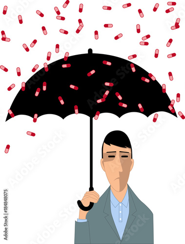 Depressed man under umbrella, covering from a rain of pills, EPS 8 vector illustration photo