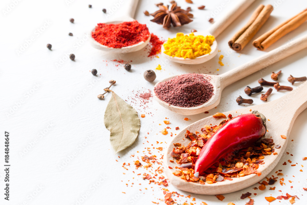 seasoning and spices on a white background closeup - obrazy, fototapety, plakaty 