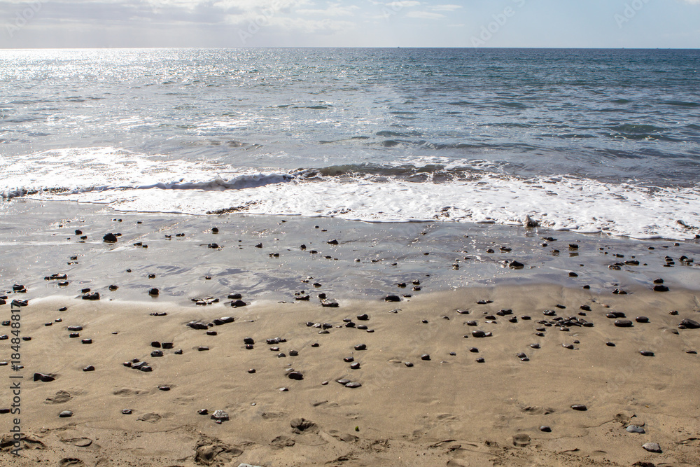Sand beach with sea stones