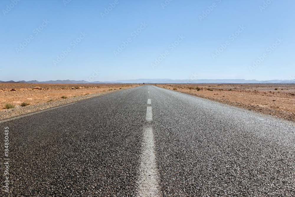 travel on empty highway in Sahara desert travel on empty highway in Sahara desert
