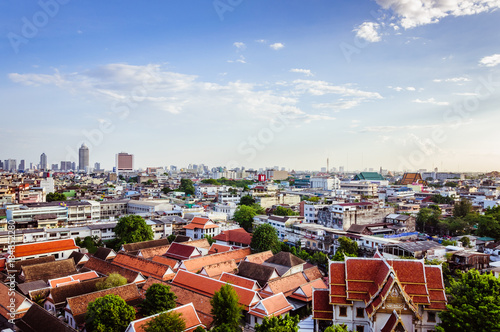 High view on Bangkok city under blue sky and small clouds