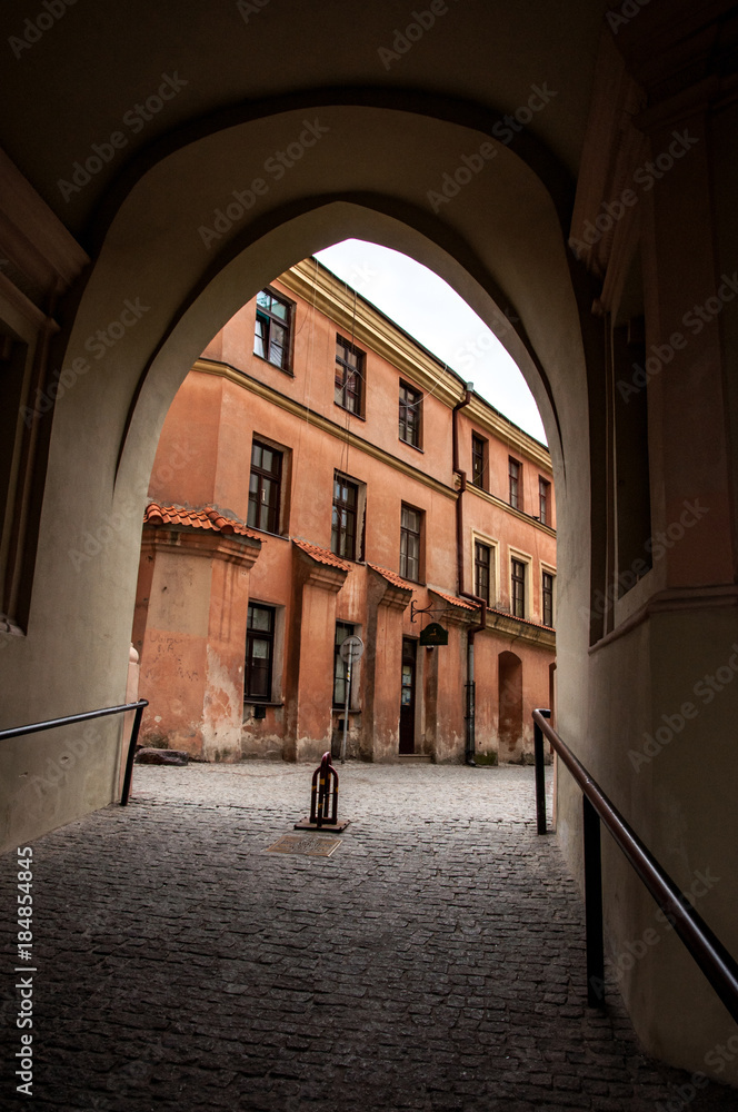 View on the old building through the arch