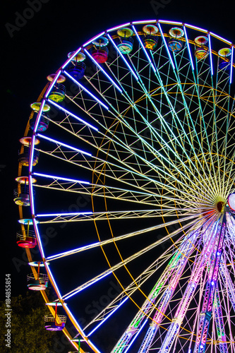 Big ferry wheel in the park by night