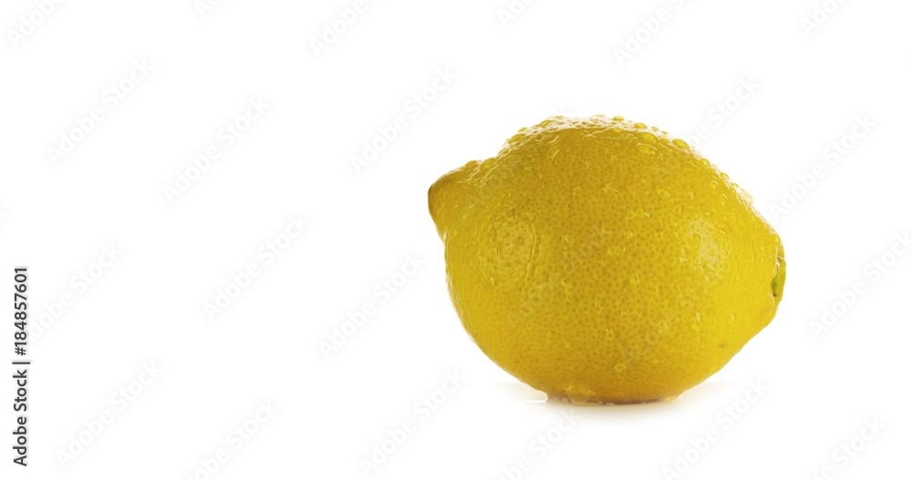 Fresh Lemon with water droplet flowing down on white background. Natural citrus Organic Healthy Food 4K video Fresh Lemon with water droplet flowing down on white background. Natural citrus Organic Healthy Food 4K video