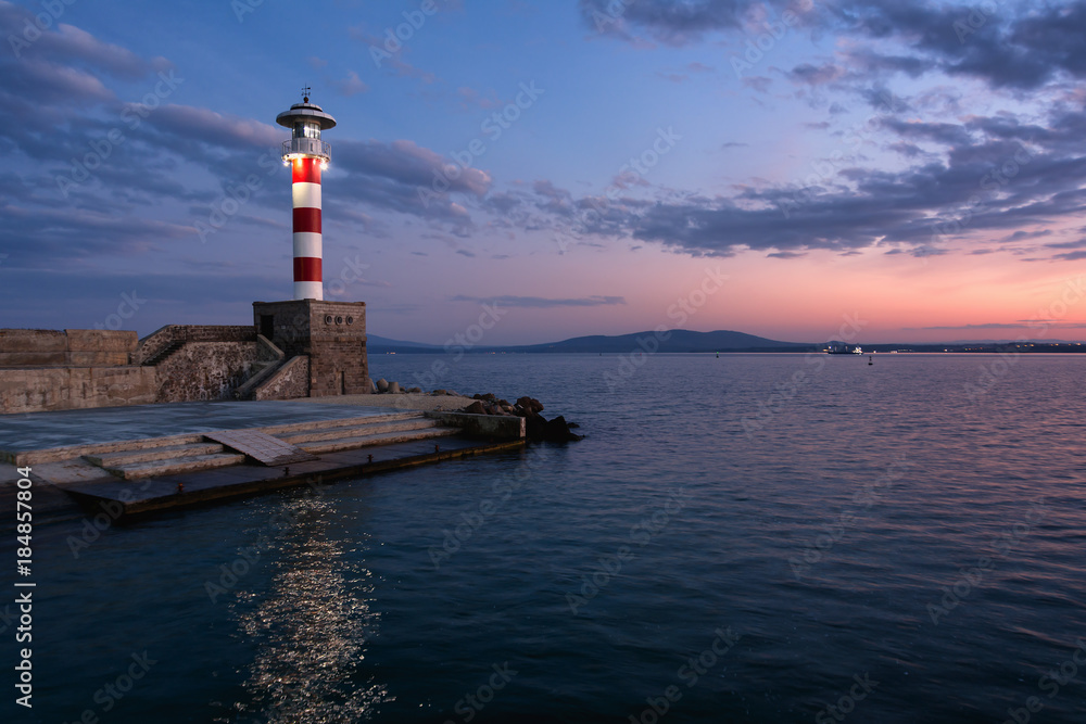 Lighthouse at sunset in port Burgas, Black Sea, Bulgaria.