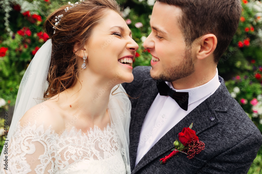 Close-up of a happy young couple who sincerely smiles at each ot Close-up of a happy young couple who sincerely smiles at each ot