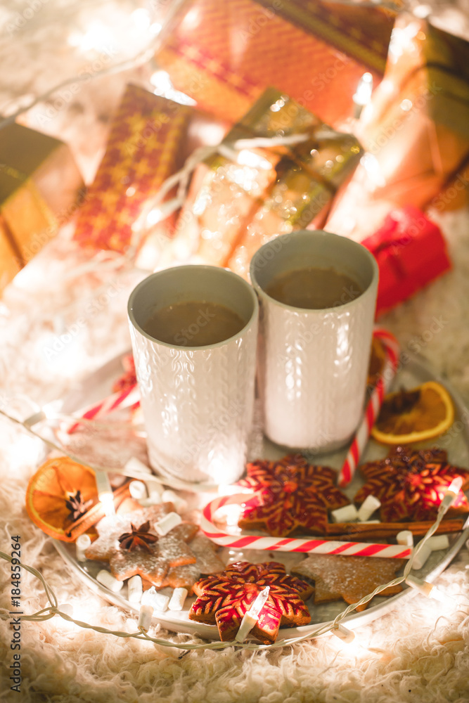 Hot chocolate drink with biscuits under the christmas tree