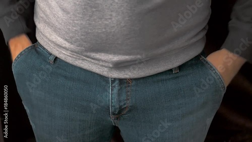 Man showing his empty pockets photo