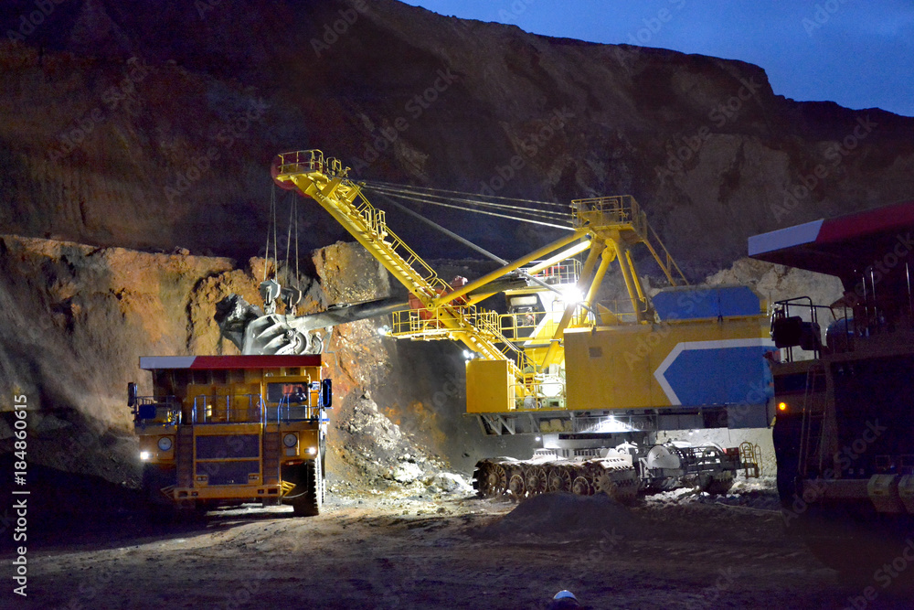 Loading rock in the quarry at night