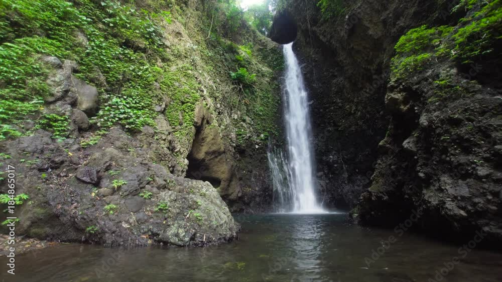 Waterfall in green rainforest. waterfall in the mountain jungle. Bali,Indonesia. Travel concept. Waterfall in green rainforest. waterfall in the mountain jungle. Bali,Indonesia. Travel concept.
