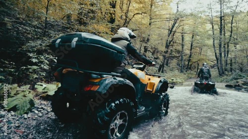 Man on the ATV Quad Bike on the mountains road.
