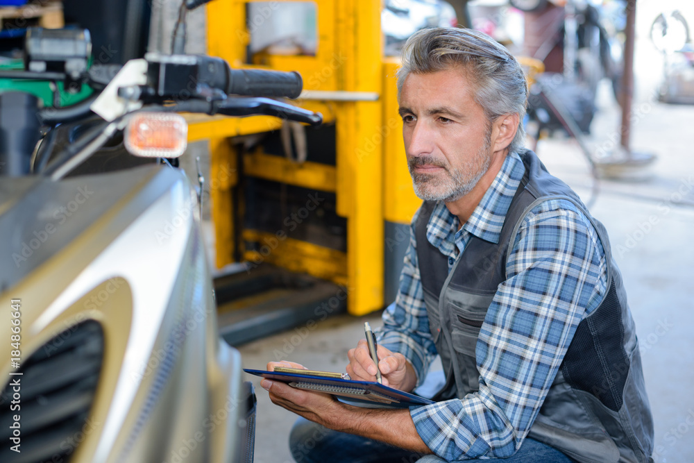 mechanic writing a report mechanic writing a report