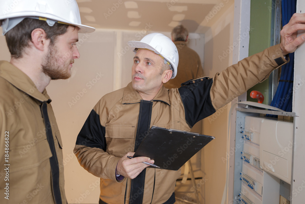 contractor manager talking to the apprentice contractor manager talking to the apprentice