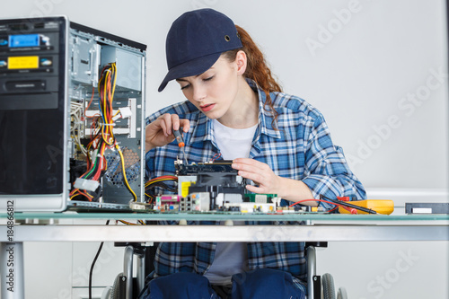 Wallpaper Mural handicapped young woman assembling the motherboard Torontodigital.ca