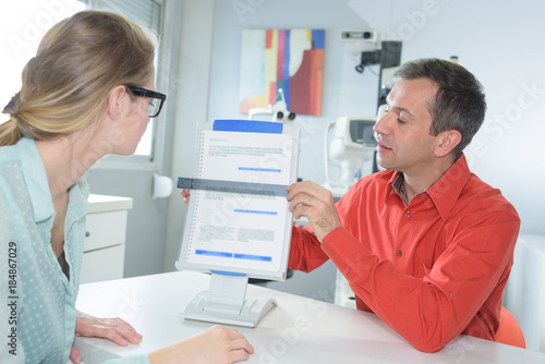 Wallpaper Mural man is showing a document to doctor Torontodigital.ca