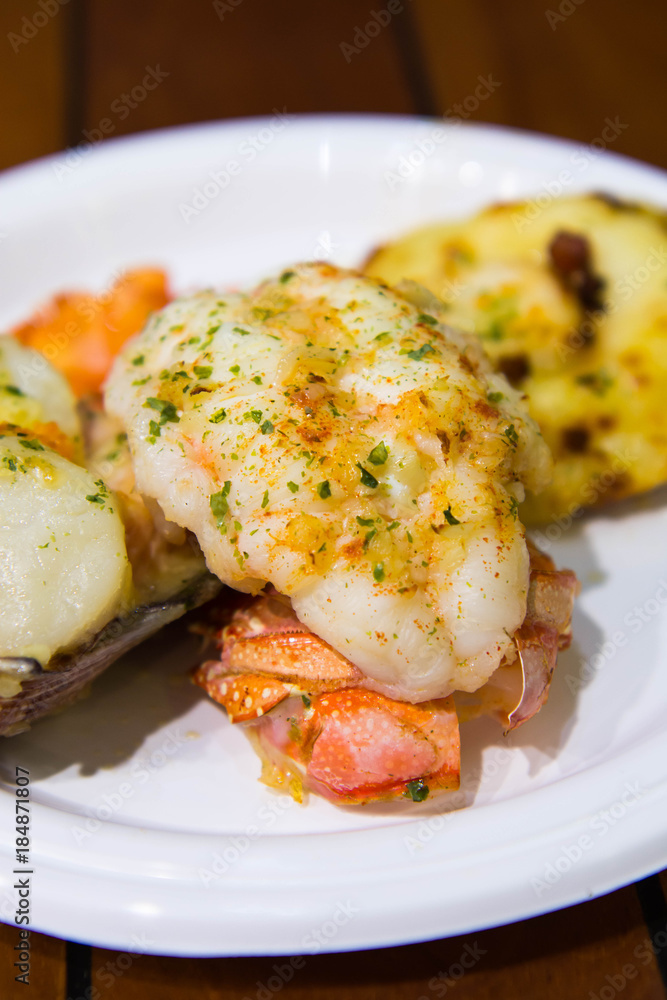 giant scallop with salmon and lobster tail giant scallop with salmon and lobster tail