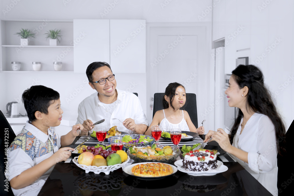 Happy family eating meals in the kitchen Happy family eating meals in the kitchen