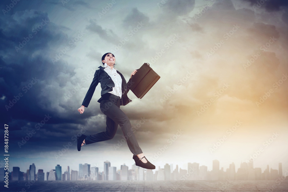Beautiful businesswoman running on the road Beautiful businesswoman running on the road