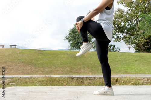 woman man prepare for exercise warm up body leg berfore sport jogging photo