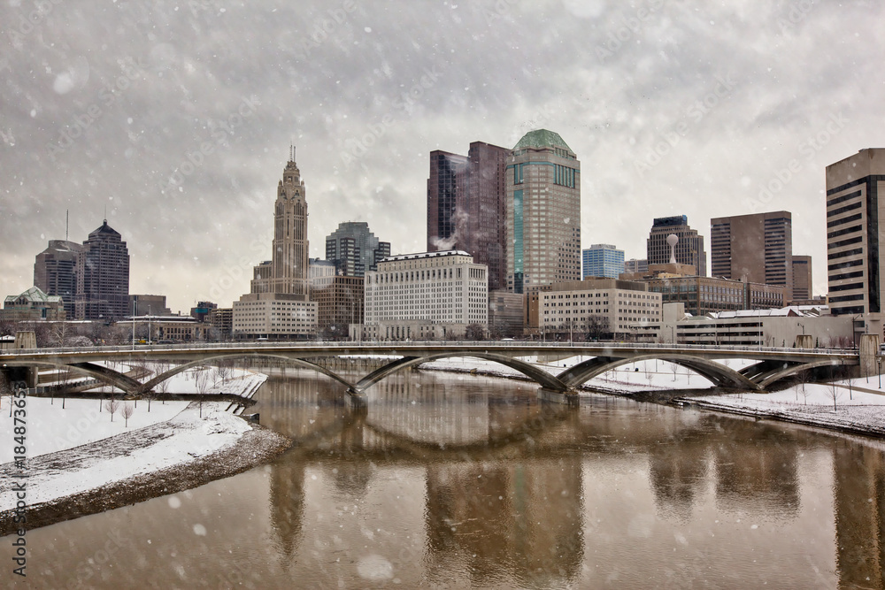 The Columbus, Ohio skyline along the Scioto River waterfront on a snowy day