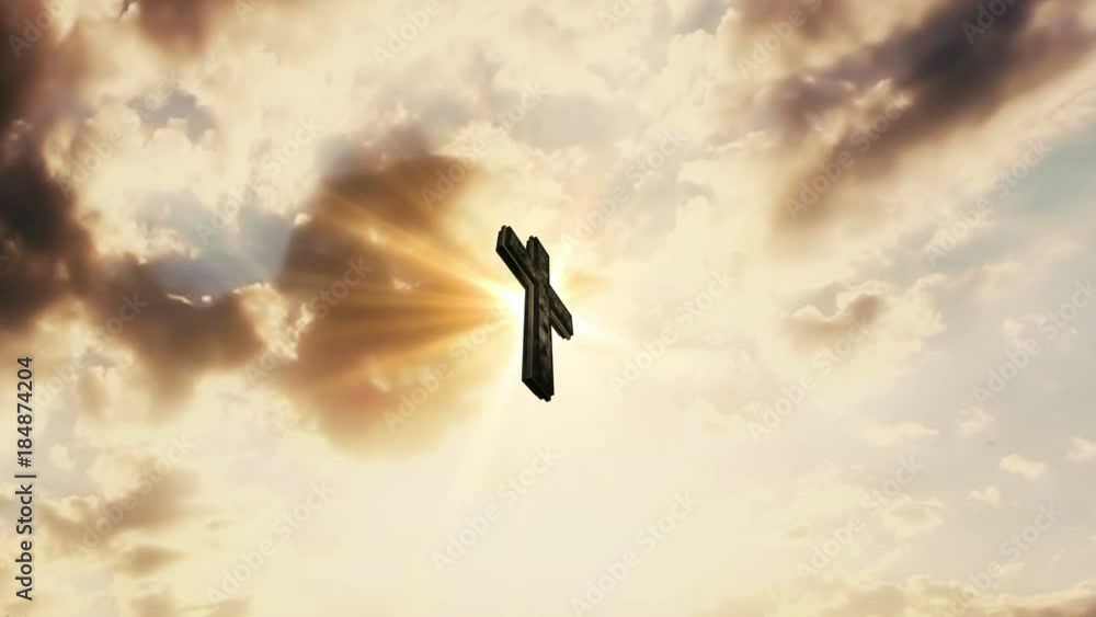 Cross In The Sky With Moving Clouds and Sun Rays In The Background. Catholic Religion Concept Cross In The Sky With Moving Clouds and Sun Rays In The Background. Catholic Religion Concept