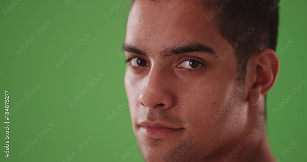 Close up portrait of Millennial Hispanic tourist on green screen. On green screen to be keyed or composited. Close up portrait of Millennial Hispanic tourist on green screen. On green screen to be keyed or composited.