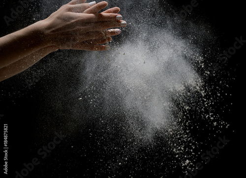 White dust cloud close up shot on black