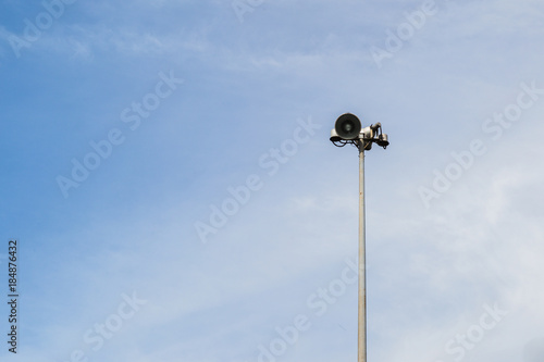 Spot light pole on blue sky and clouds.