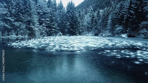 aerial flight over winter landscape in ebensee photo