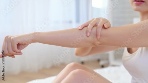 beautiful lady touching arm smoothly up.