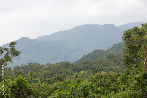 Tropical landscape with hills in national park Ya Nuo Da on island of Hainan © neonnspb