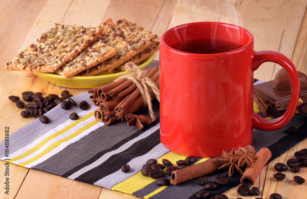 Hot coffee / tea, spices on a wooden background. Christmas. Comfort. Hot coffee / tea, spices on a wooden background. Christmas. Comfort.