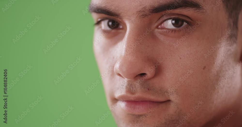 Close up of happy smiling Hispanic Millennial tourist on green screen. On green screen to be keyed or composited. Close up of happy smiling Hispanic Millennial tourist on green screen. On green screen to be keyed or composited.