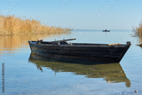 Fototapeta Naklejka Na Ścianę i Meble -  Traditional fishing boat Traditionally, many different kinds of boats have been used as fishing boats to catch fish in the sea, or on a lake or river.