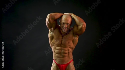 bodybuilder posing in studio