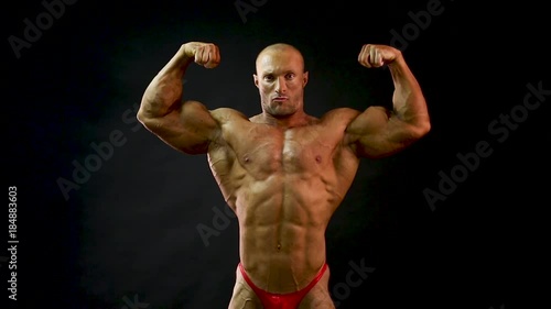 bodybuilder posing in studio