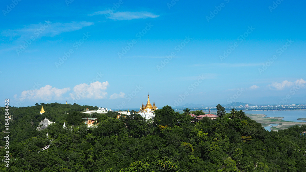 High angle view of multiple temples and pagodas on the mountains with Irrawaddy river in the background from sagaing hill, Sagaing region of Myanmar High angle view of multiple temples and pagodas on the mountains with Irrawaddy river in the background from sagaing hill, Sagaing region of Myanmar
