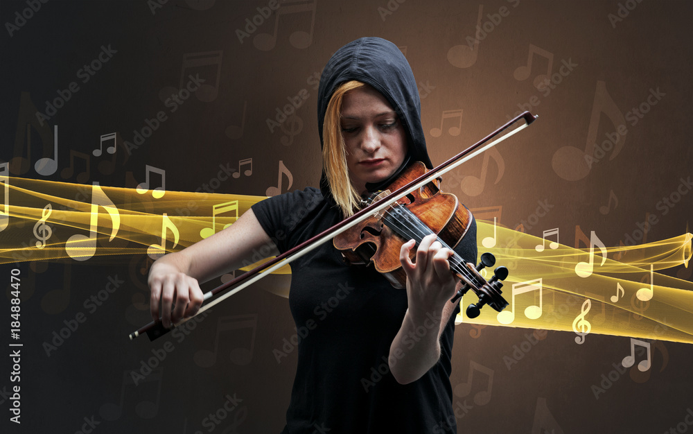 Fototapeta premium Musician playing on violin with notes around
