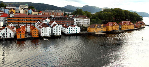 Bergen is a coastal town in the county of Hordaland, in the Vestlandet region of Norway. Bergen is nicknamed the city of rain or the European Seattle. View of the harbor with typical buildings