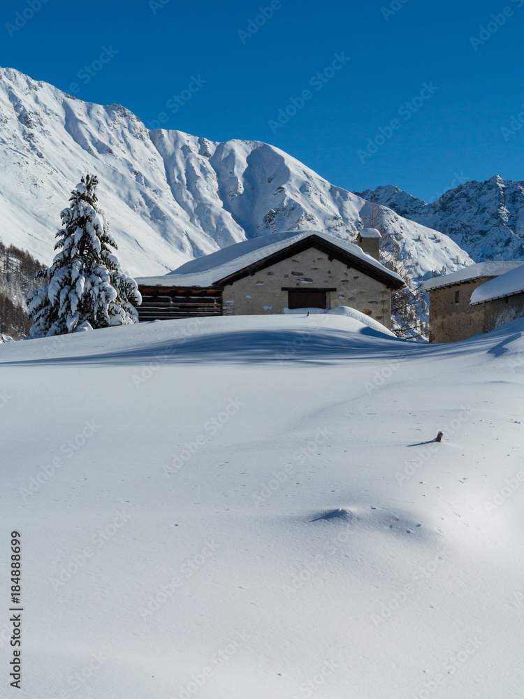 Chalet covered with snow, winter landscape
