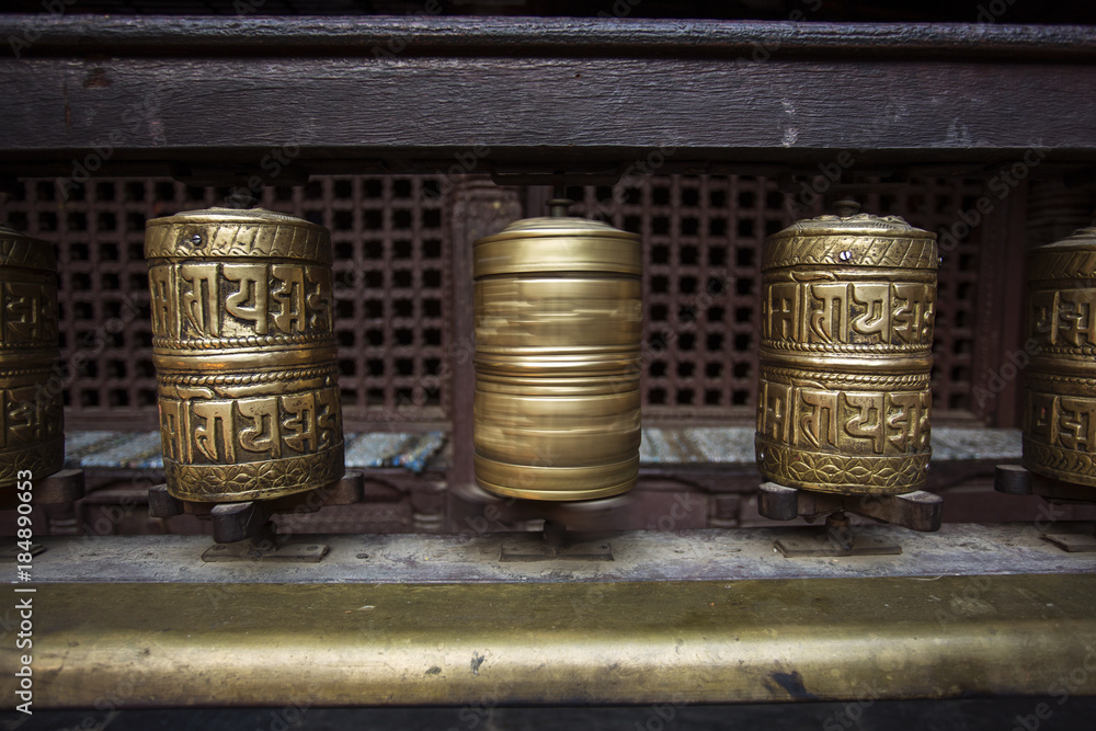 Prayer wheels made from metal at Golden Temple in Patan Durbar Square, Kathmandu, Nepal Prayer wheels made from metal at Golden Temple in Patan Durbar Square, Kathmandu, Nepal