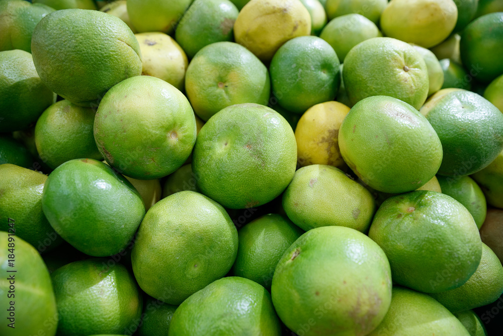 green grapefruit in the market stalls green grapefruit in the market stalls