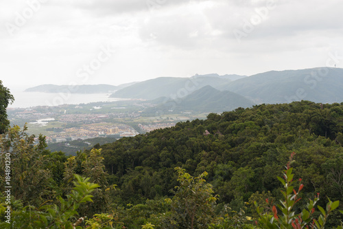 View of the tropical forest and the sea from one of the viewing platforms in the park Yalong Bay Tropic Paradise Forest